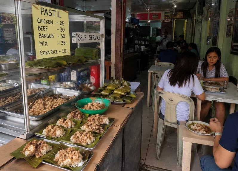 Pastil — banana leaf-wrapped rice with shredded chicken